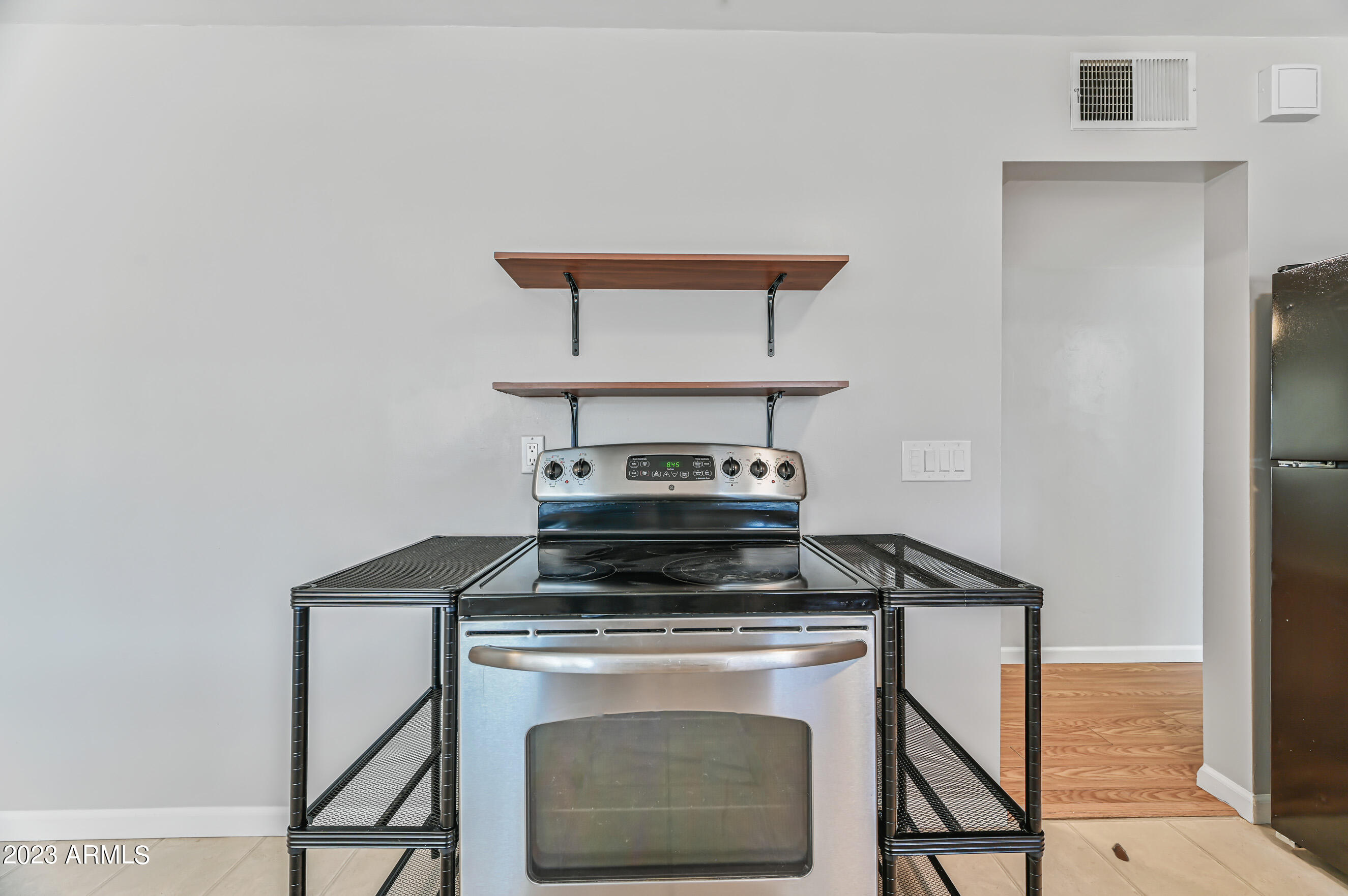 1227 East Las Palmaritas Drive Phoenix, AZ 85020 - Photo 7 of 22 a stove top oven sitting inside of a kitchen