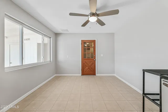 a view of an empty room with a window