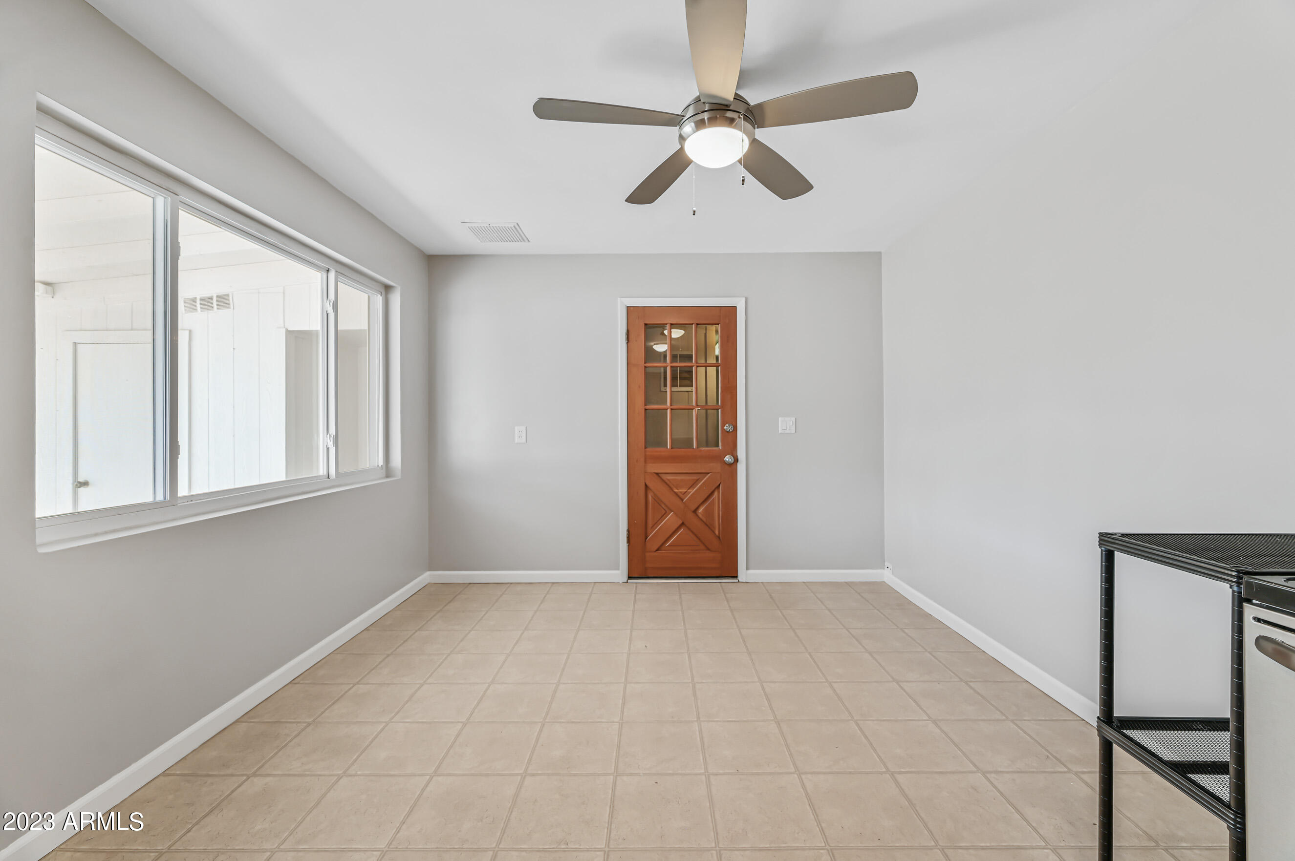 1227 East Las Palmaritas Drive Phoenix, AZ 85020 - Photo 8 of 22 a view of an empty room with a window