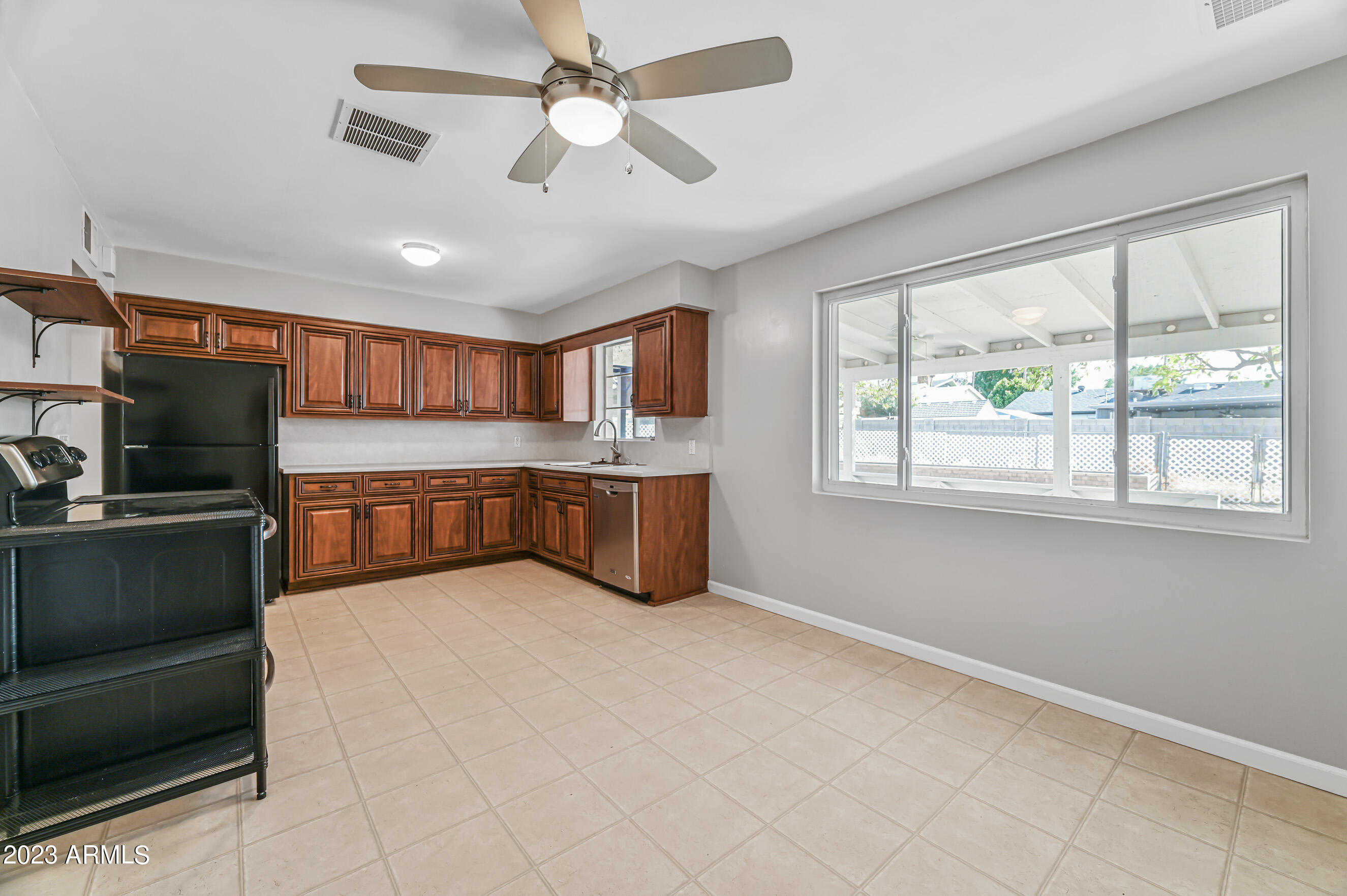 1227 East Las Palmaritas Drive Phoenix, AZ 85020 - Photo 9 of 22 a large white kitchen with a large window