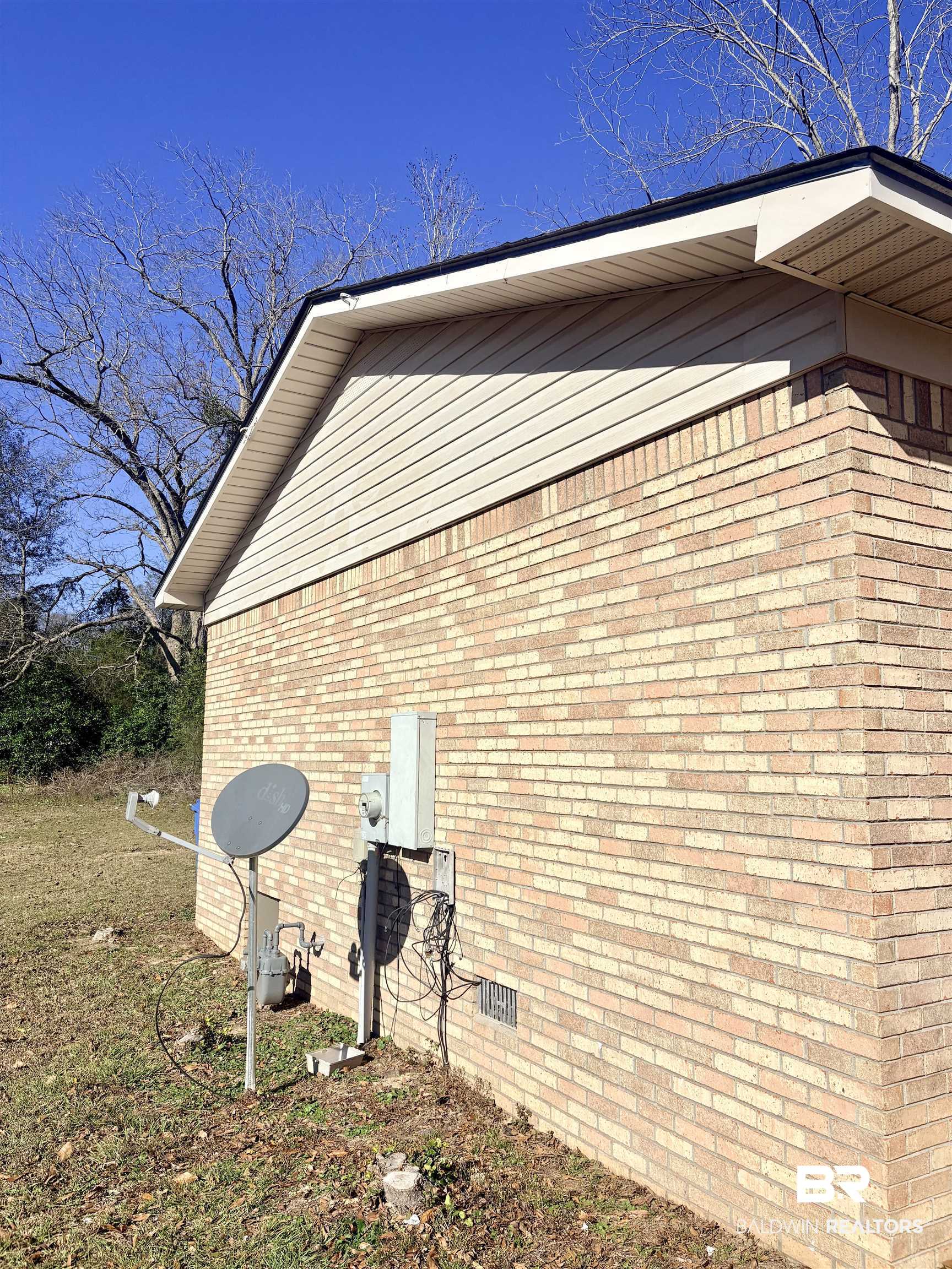47 Fairview Street Evergreen, AL 36401 - Photo 13 of 15 View of side of property with crawl space and brick siding