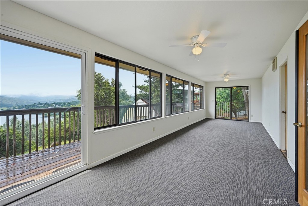 17312 Greenridge Road Hidden Valley Lake, CA 95467 - Photo 13 of 34 a view of an empty room with wooden floor and a window
