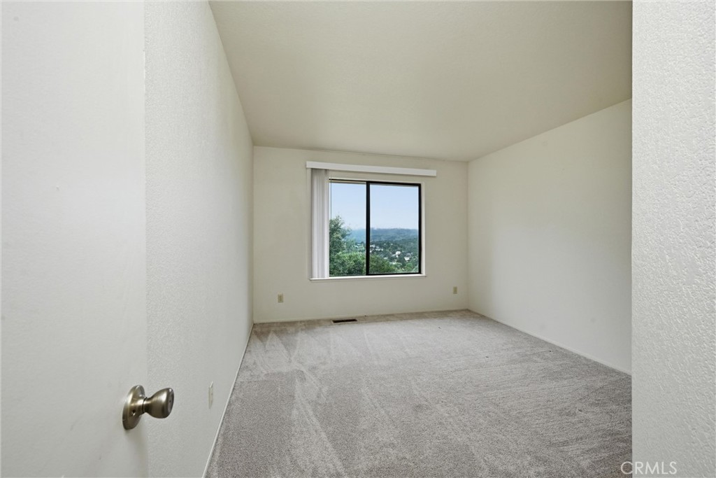 17312 Greenridge Road Hidden Valley Lake, CA 95467 - Photo 23 of 34 a view of room with window and hardwood floor