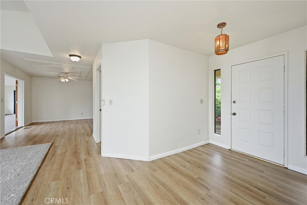 17312 Greenridge Road Hidden Valley Lake, CA 95467 - Photo 2 of 34 an empty room with wooden floor and window