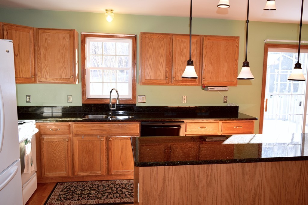 55 Baypath Road Warren, MA 01083 - Photo 9 of 25 a kitchen with stainless steel appliances granite countertop a stove a sink and a microwave