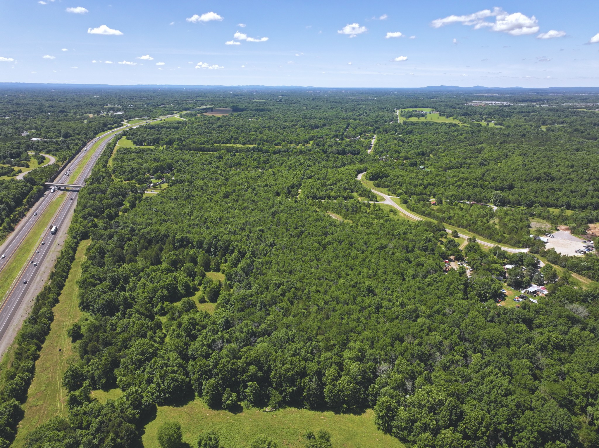 0 Buckeye Bottom Road East Murfreesboro, TN 37129 - Photo 7 of 9 a view of a green field with lots of bushes