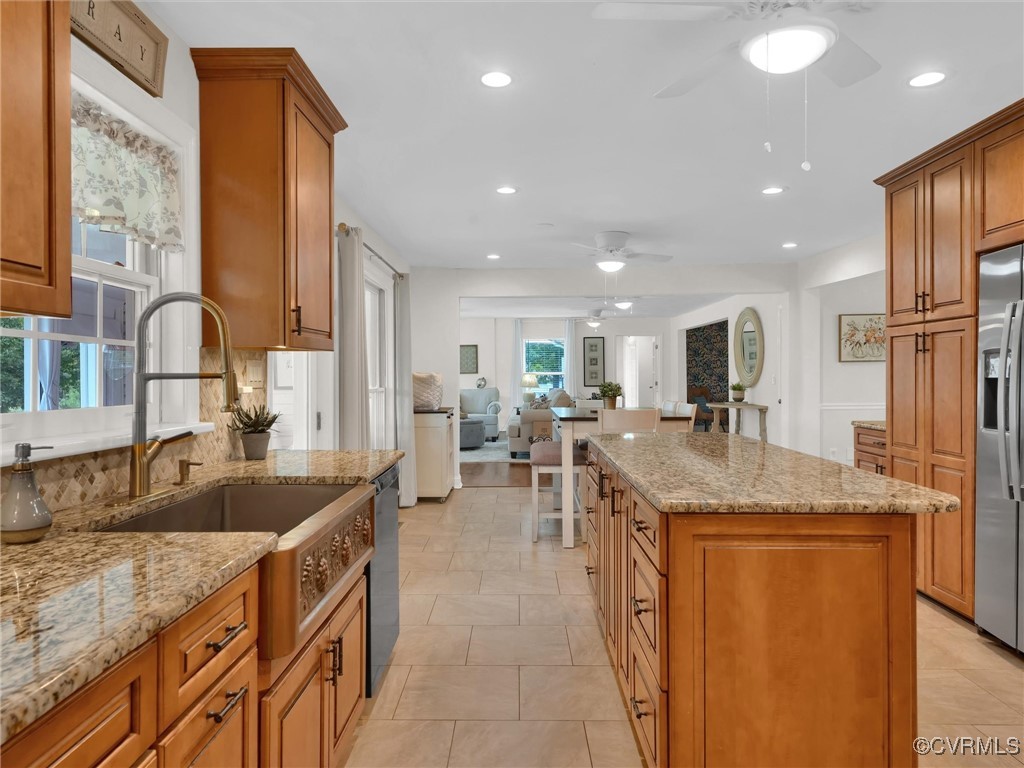 727 Eanes Road Kenbridge, VA 23944 - Photo 16 of 50 a kitchen with stainless steel appliances granite countertop a sink counter space and a view of living room
