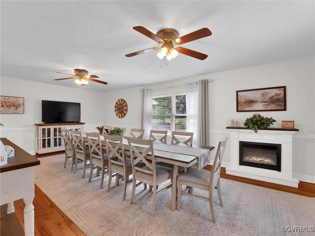 727 Eanes Road Kenbridge, VA 23944 - Photo 20 of 50 a view of a livingroom with furniture a fireplace a rug and a window