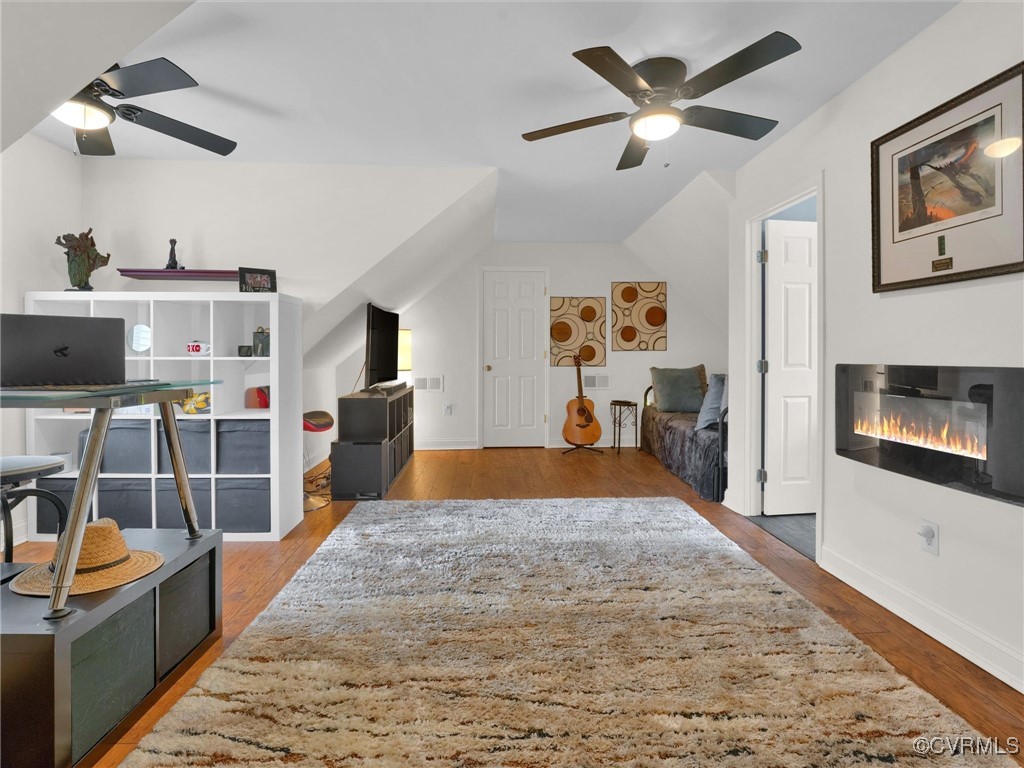 727 Eanes Road Kenbridge, VA 23944 - Photo 29 of 50 a living room with furniture a flat screen tv and kitchen view