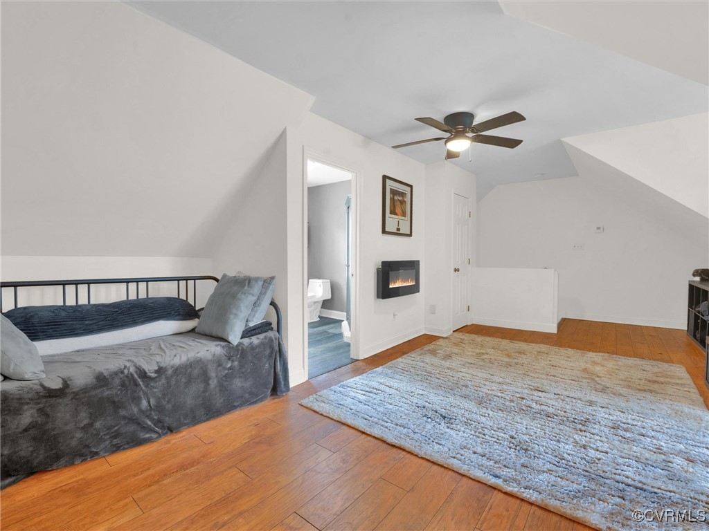 727 Eanes Road Kenbridge, VA 23944 - Photo 30 of 50 a bedroom with a large bed and a chandelier