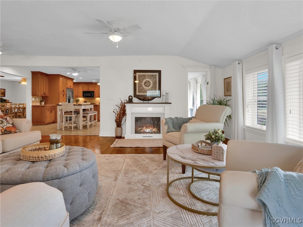 727 Eanes Road Kenbridge, VA 23944 - Photo 10 of 50 a living room with furniture a fireplace and a large window