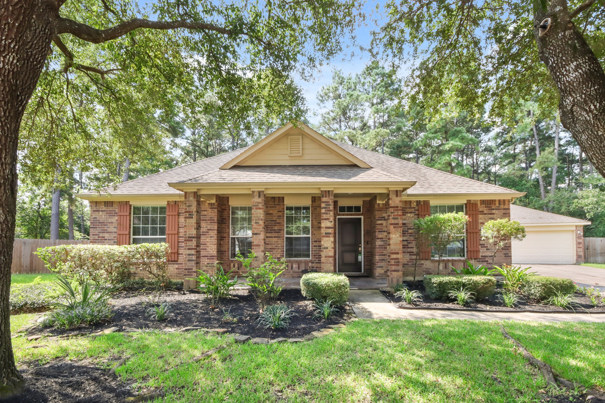 a front view of a house with a yard and porch