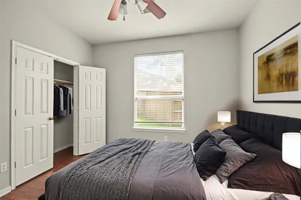 a bedroom with a bed and a couch