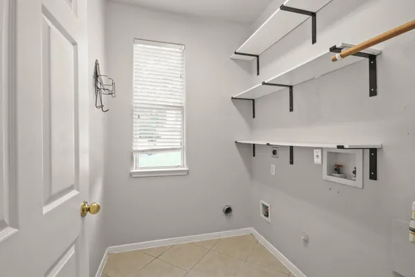 a front view of a house with a yard and porch