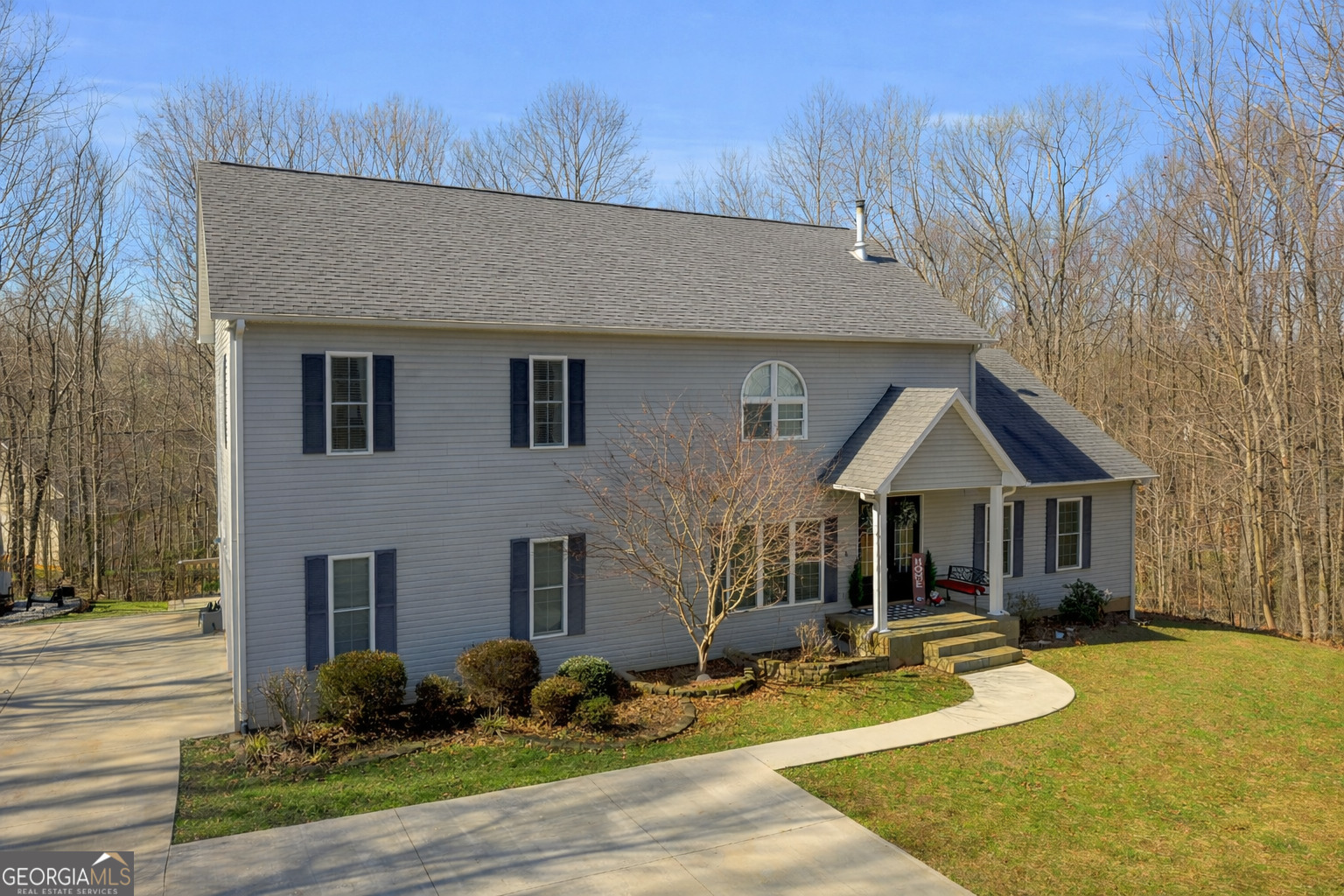 141 Shadow Walk Drive Mount Airy, GA 30563 - Photo 1 of 65 a front view of a house with yard porch and furniture