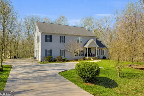 a front view of a house with a yard