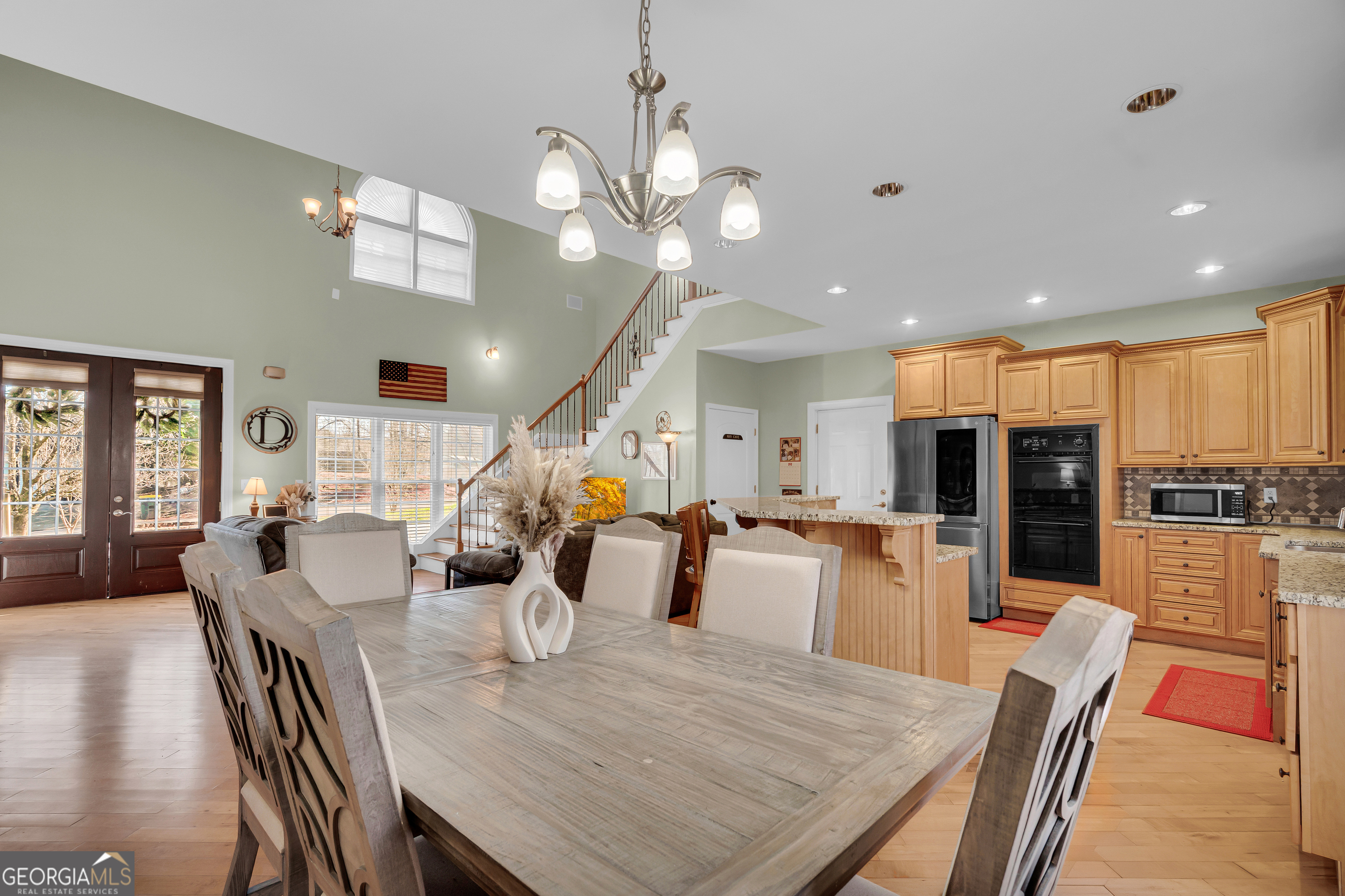 141 Shadow Walk Drive Mount Airy, GA 30563 - Photo 14 of 65 a view of a dining room and livingroom with furniture wooden floor a chandelier