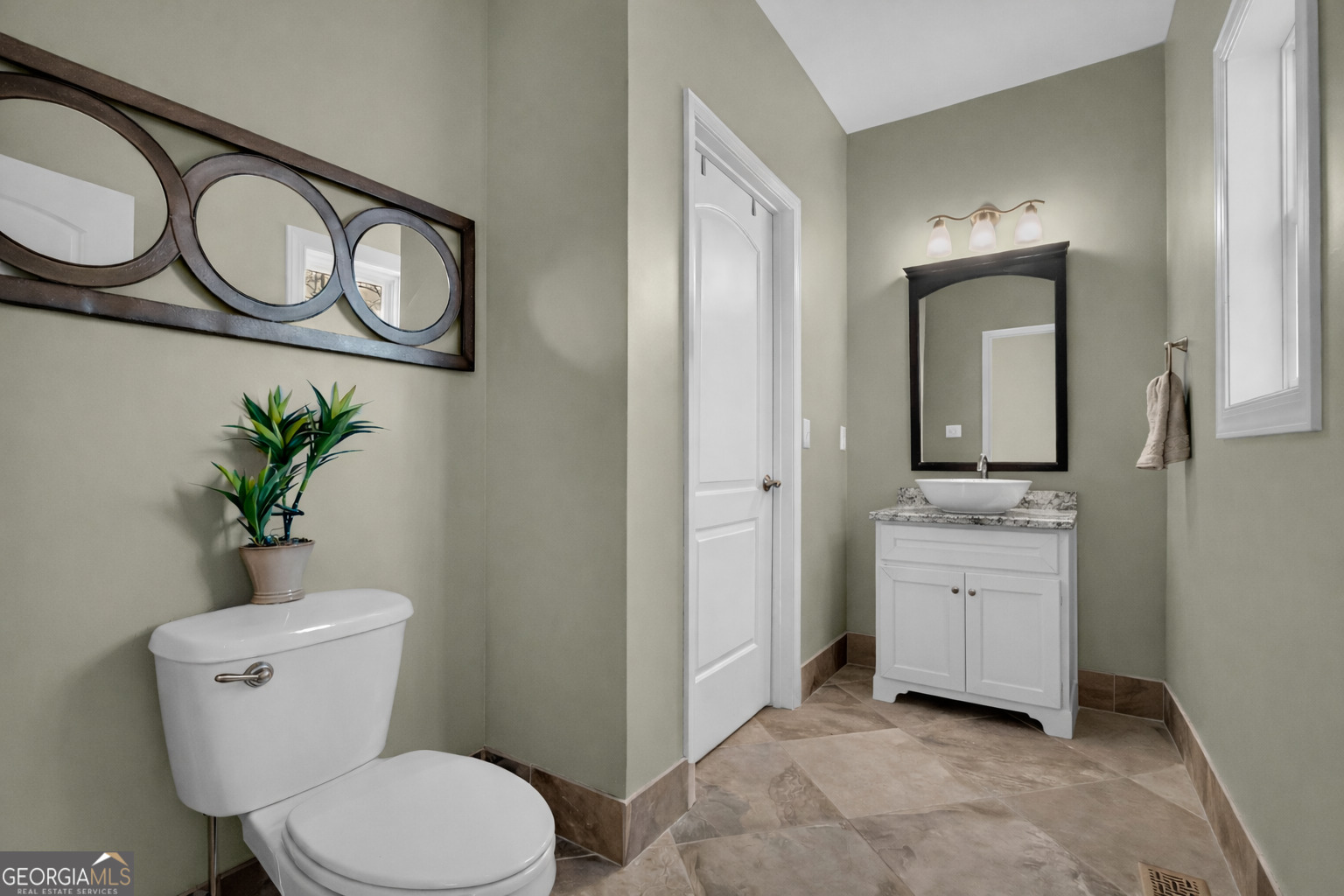 141 Shadow Walk Drive Mount Airy, GA 30563 - Photo 21 of 65 a bathroom with a toilet sink and mirror