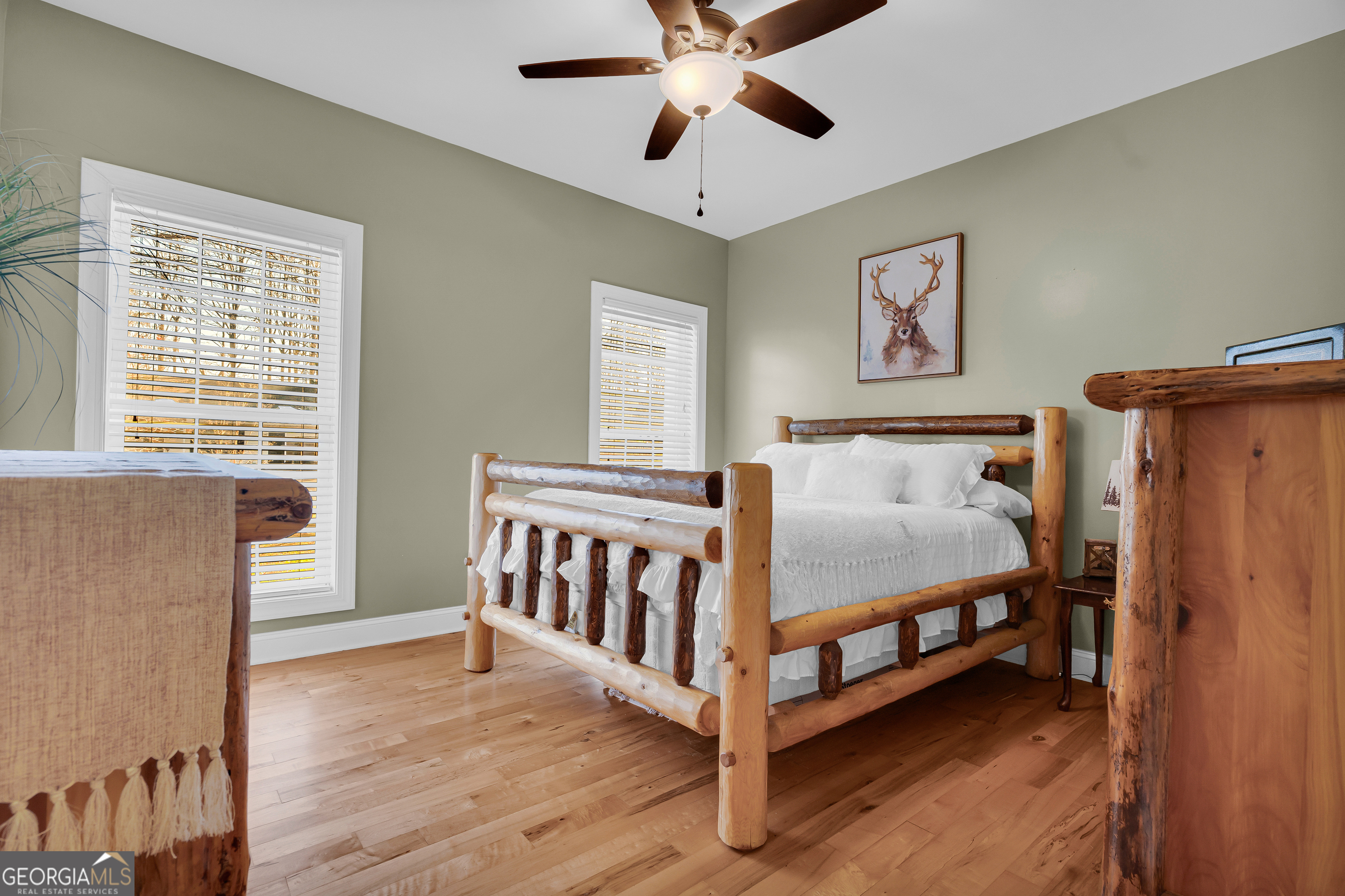 141 Shadow Walk Drive Mount Airy, GA 30563 - Photo 22 of 65 a bedroom with a bed and a window