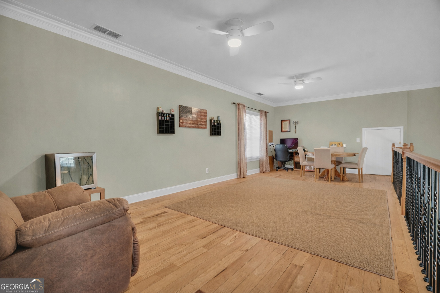 141 Shadow Walk Drive Mount Airy, GA 30563 - Photo 27 of 65 a living room with furniture and a flat screen tv