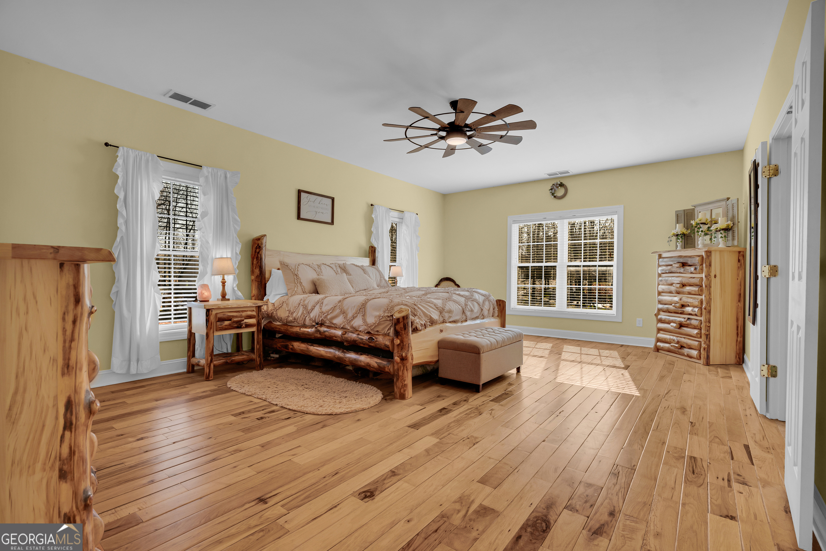 141 Shadow Walk Drive Mount Airy, GA 30563 - Photo 28 of 65 a spacious bedroom with a bed and a window
