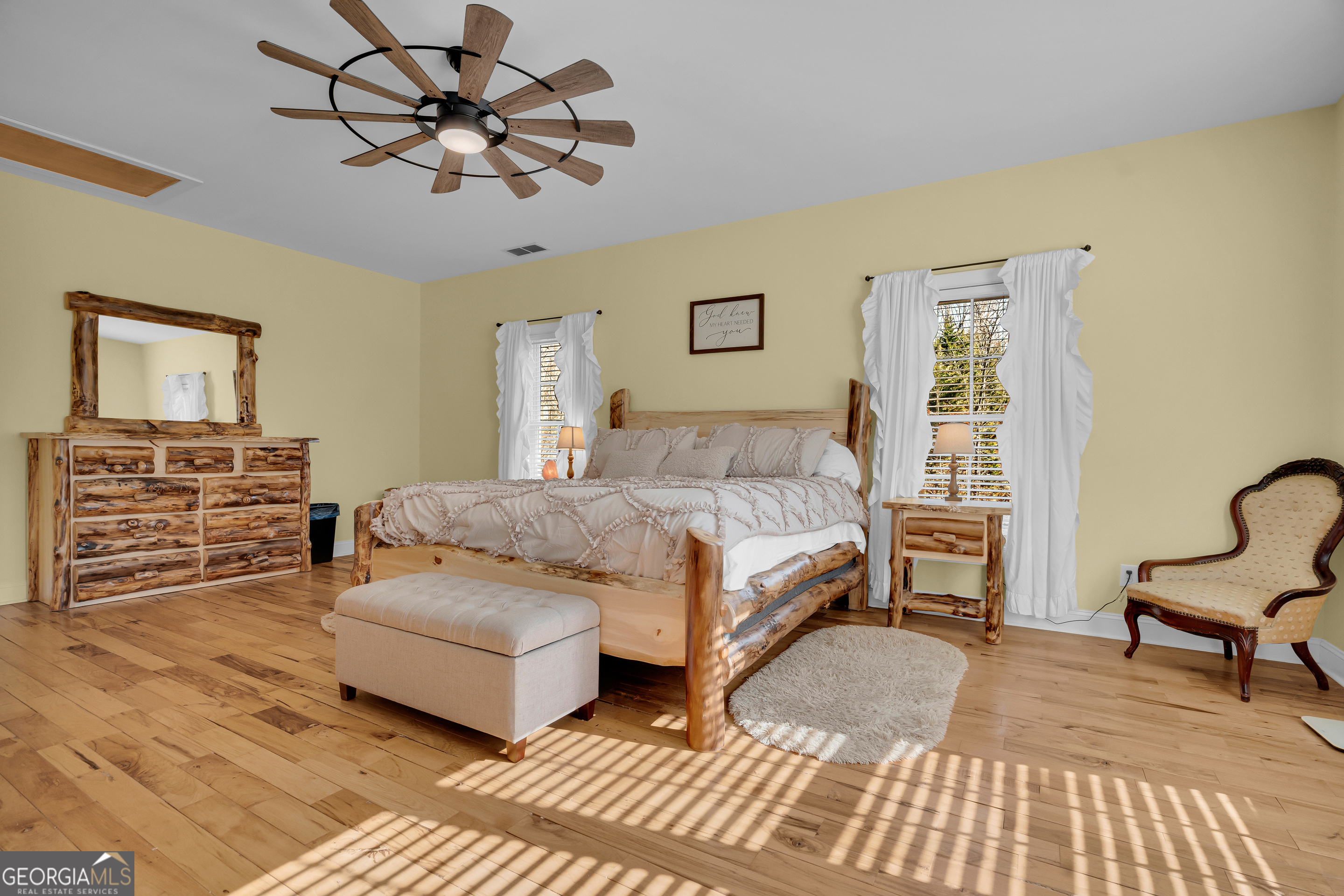 141 Shadow Walk Drive Mount Airy, GA 30563 - Photo 30 of 65 a bedroom with a bed a couch and dresser