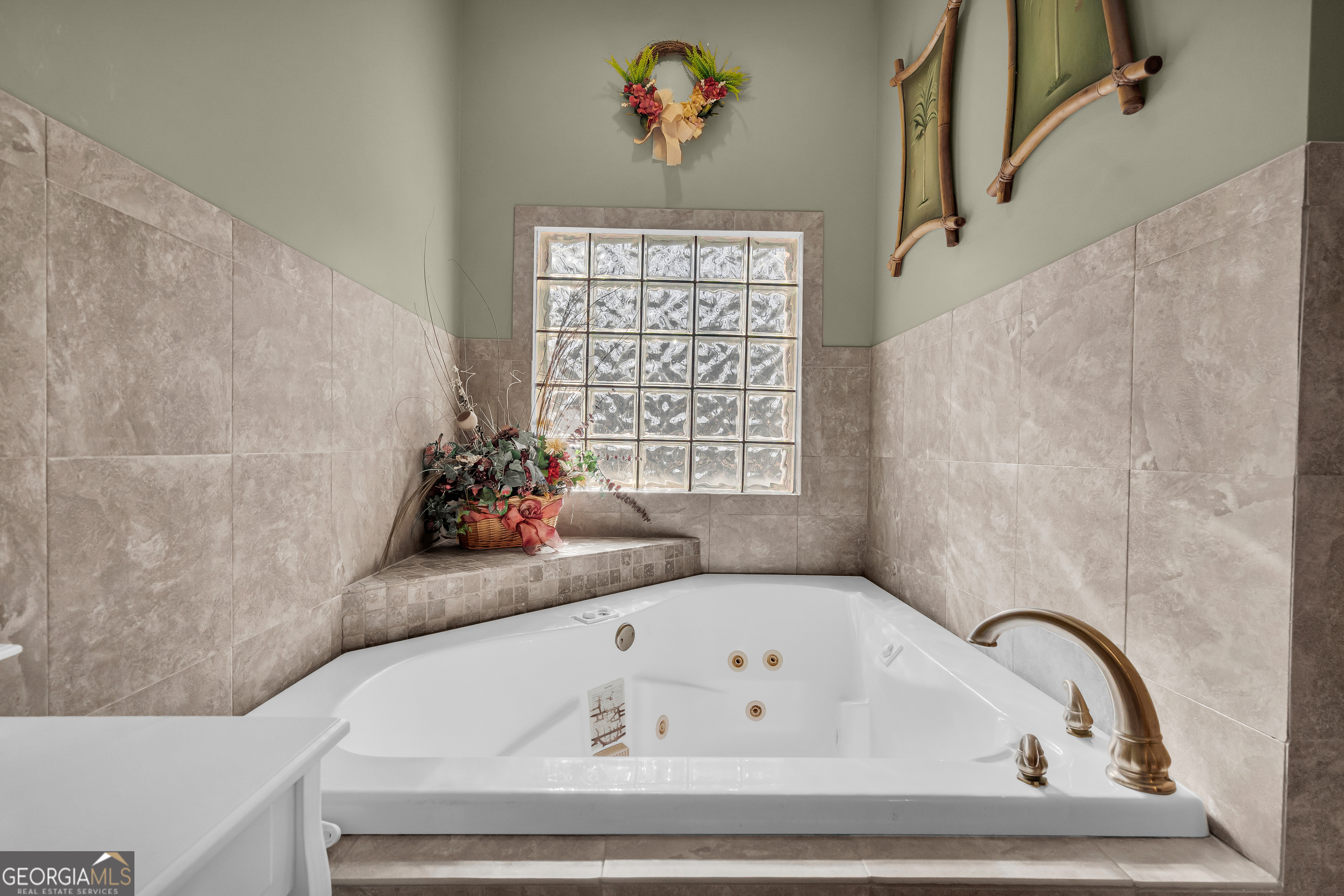 141 Shadow Walk Drive Mount Airy, GA 30563 - Photo 33 of 65 a bathroom with a bathtub and a window