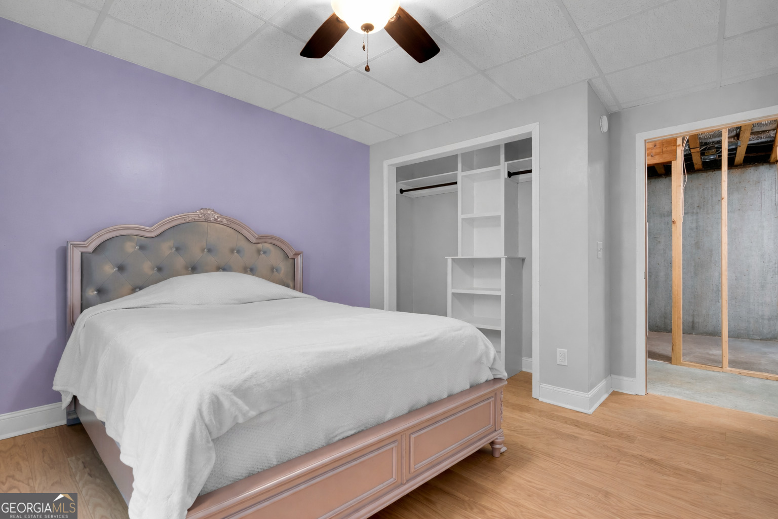 141 Shadow Walk Drive Mount Airy, GA 30563 - Photo 46 of 65 a bedroom with a bed and a chandelier