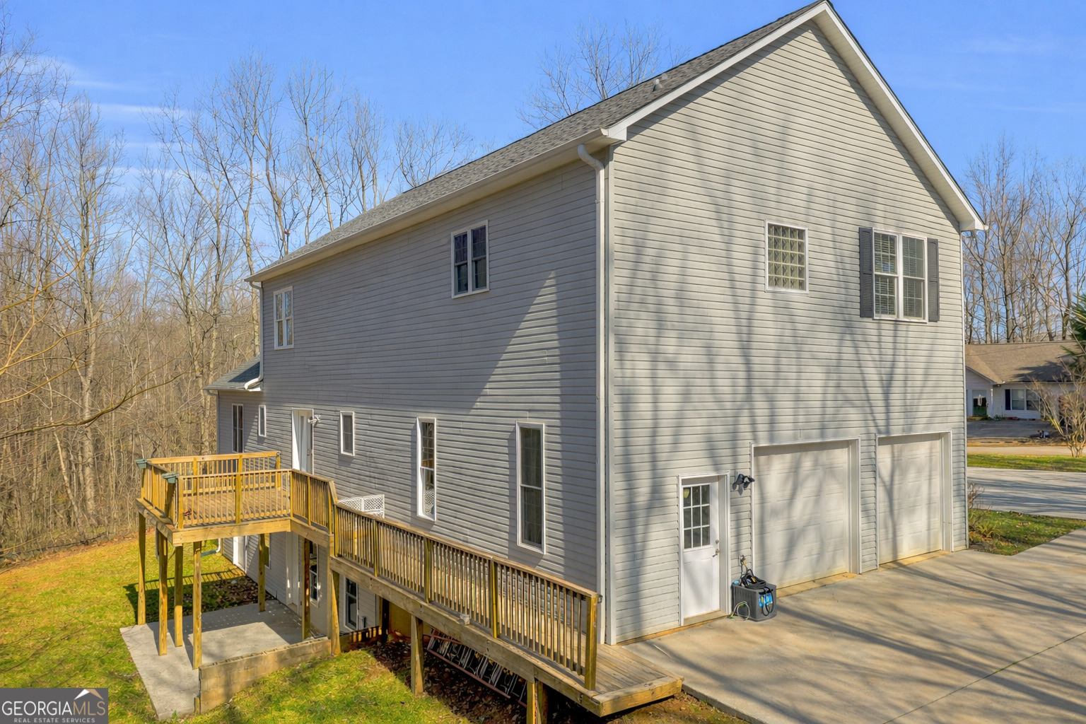 141 Shadow Walk Drive Mount Airy, GA 30563 - Photo 64 of 65 a view of a house with backyard and deck