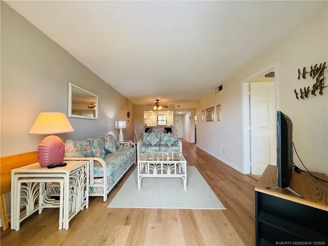 a bed room with a bed and a large window