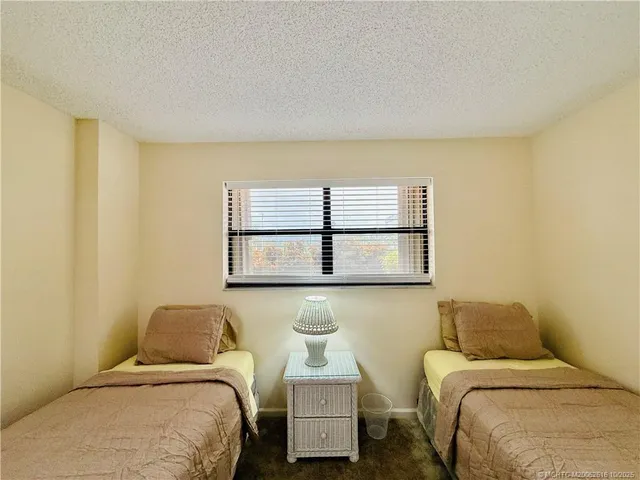 a view of a swimming pool with seating area