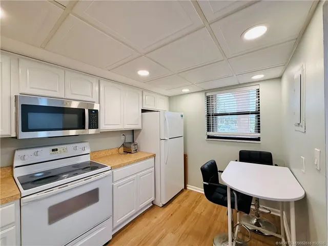 a view of a livingroom with furniture and wooden floor