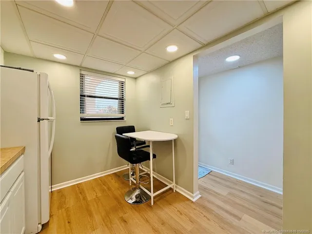 a kitchen with stainless steel appliances granite countertop a sink a stove top oven a counter space and cabinets