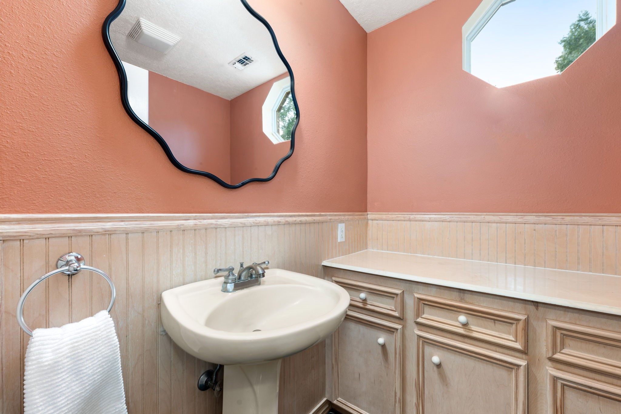 17207 Penick Road Waller, TX 77484 - Photo 18 of 37 a bathroom with a sink a mirror and a toilet