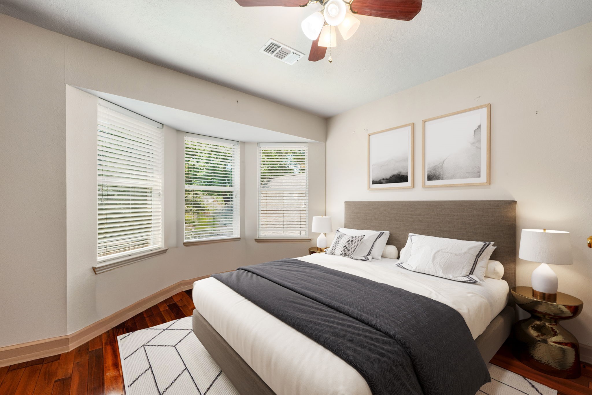 17207 Penick Road Waller, TX 77484 - Photo 28 of 37 a bedroom with a large bed and a chandelier