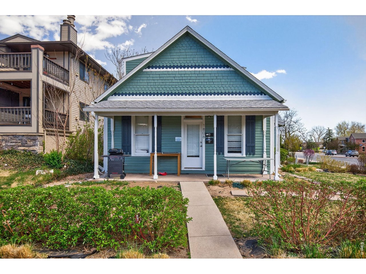 1806 17th Street Boulder, CO 80302 - Photo 1 of 45 a front view of a house with garden