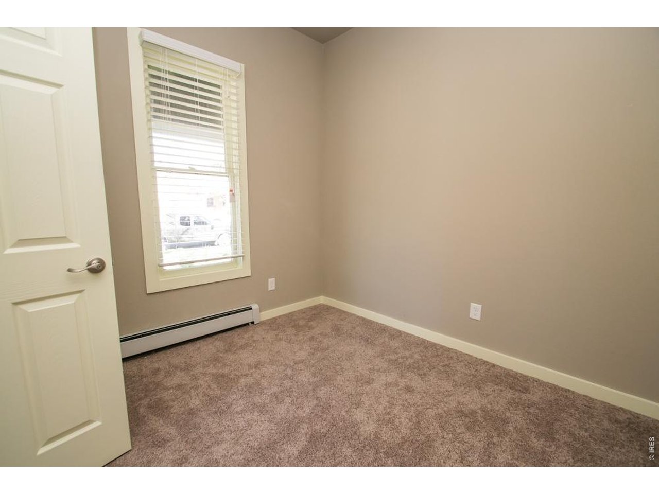 1806 17th Street Boulder, CO 80302 - Photo 18 of 45 a view of an empty room and window