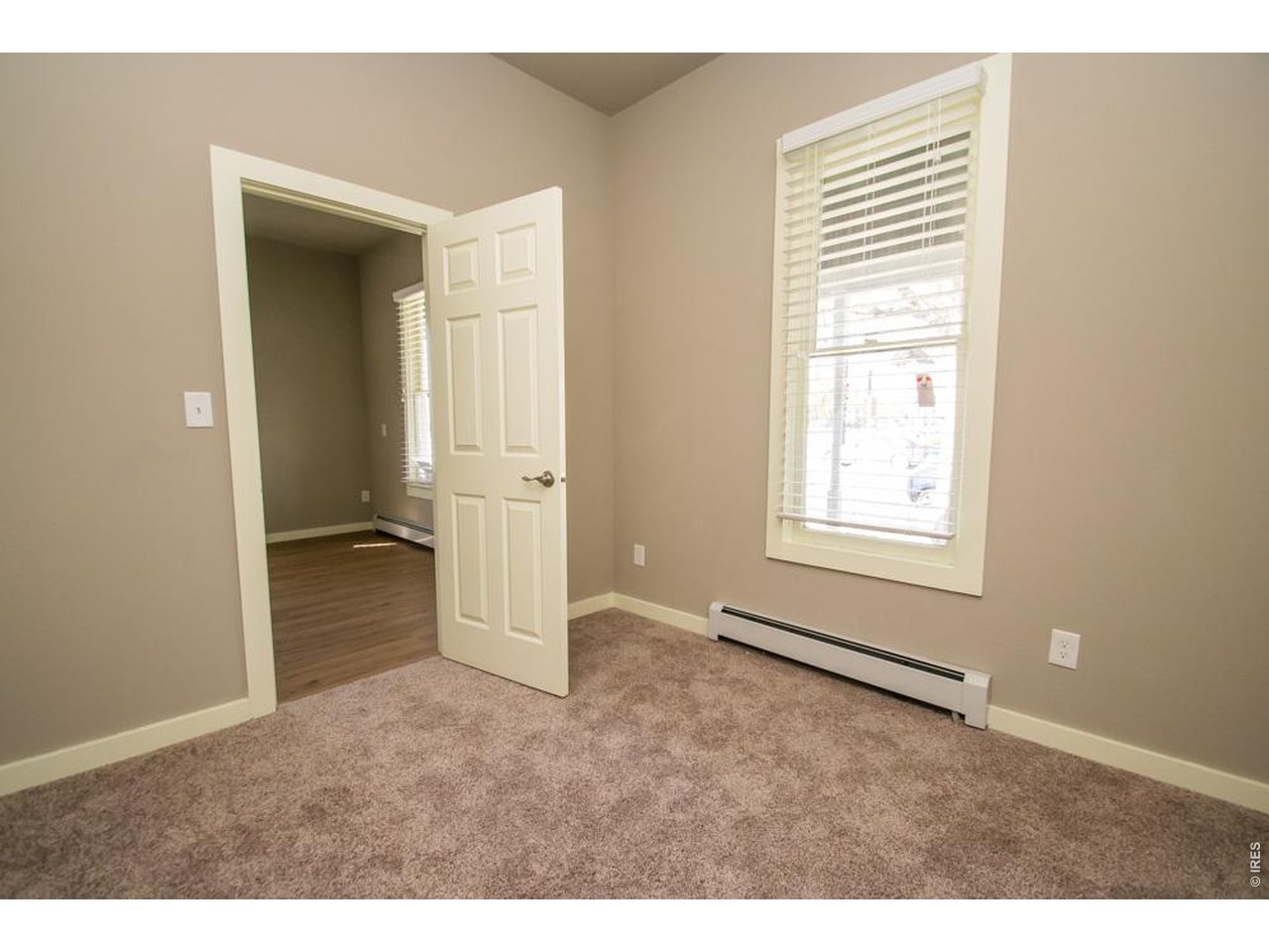 1806 17th Street Boulder, CO 80302 - Photo 19 of 45 an empty room with windows and closet