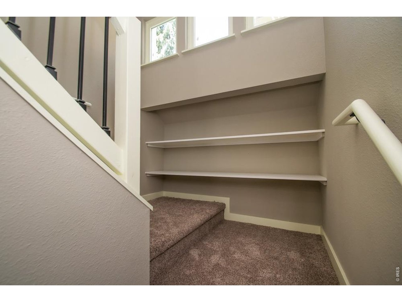 1806 17th Street Boulder, CO 80302 - Photo 23 of 45 a view of an empty room with a staircase