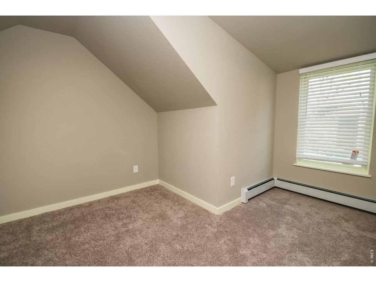 1806 17th Street Boulder, CO 80302 - Photo 27 of 45 a view of an empty room with a window