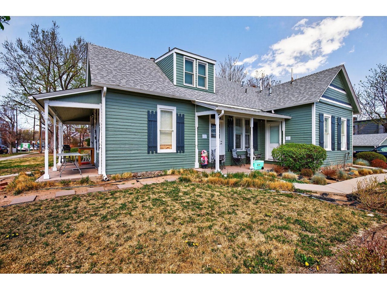 1806 17th Street Boulder, CO 80302 - Photo 3 of 45 a front view of a house with garden