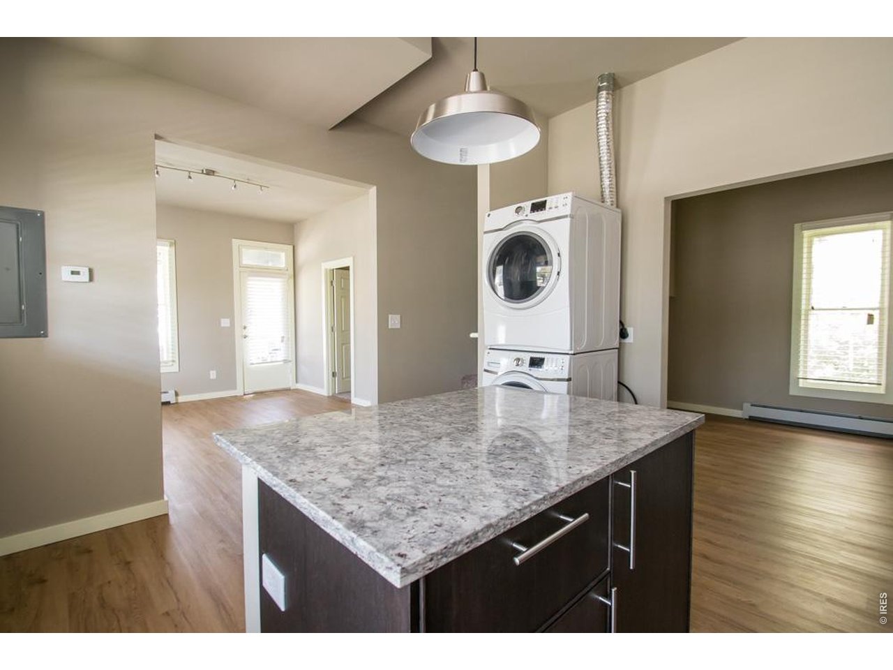 1806 17th Street Boulder, CO 80302 - Photo 9 of 45 a bathroom with a granite countertop sink a mirror and wooden floors