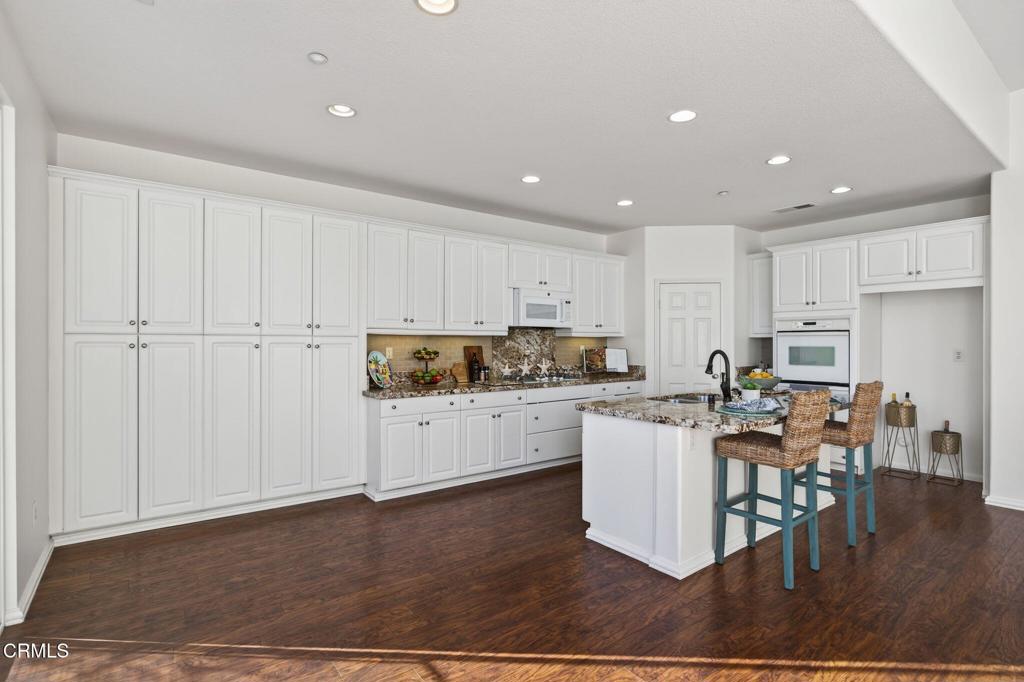 2914 Naples Drive Oxnard, CA 93035 - Photo 15 of 51 a kitchen with a sink and chairs