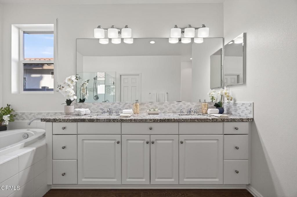 2914 Naples Drive Oxnard, CA 93035 - Photo 23 of 51 a bathroom with white cabinets and sink