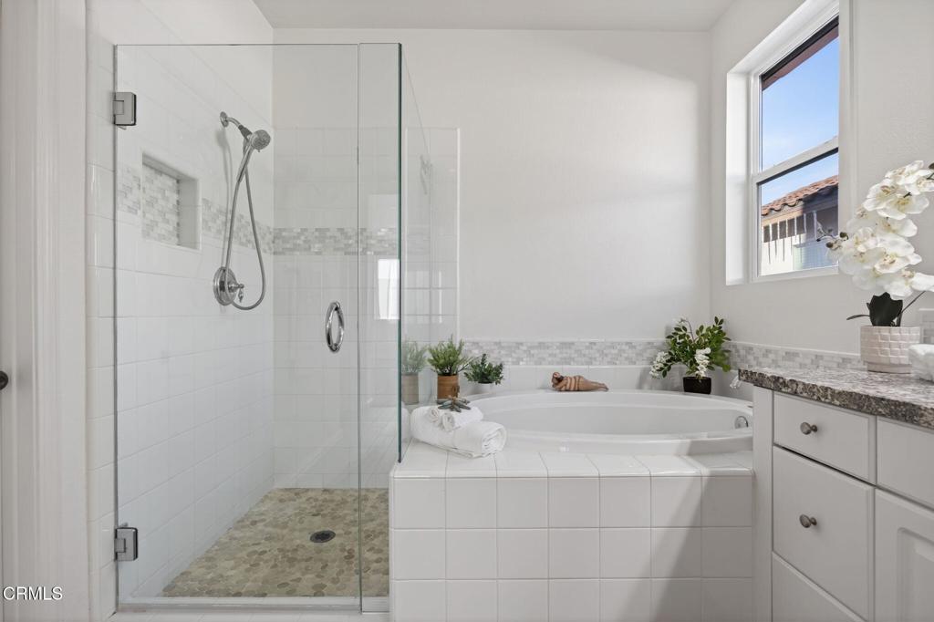 2914 Naples Drive Oxnard, CA 93035 - Photo 24 of 51 a bathroom with a granite countertop sink a shower and a mirror