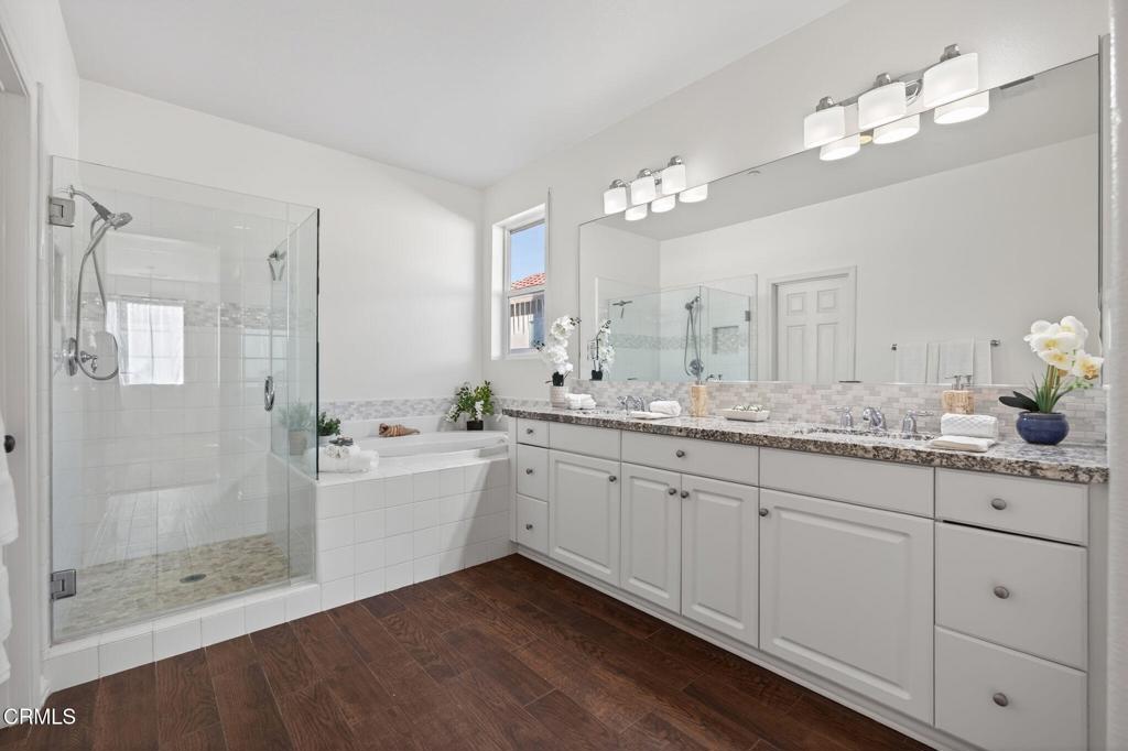 2914 Naples Drive Oxnard, CA 93035 - Photo 4 of 51 a bathroom with a double vanity sink mirror and shower