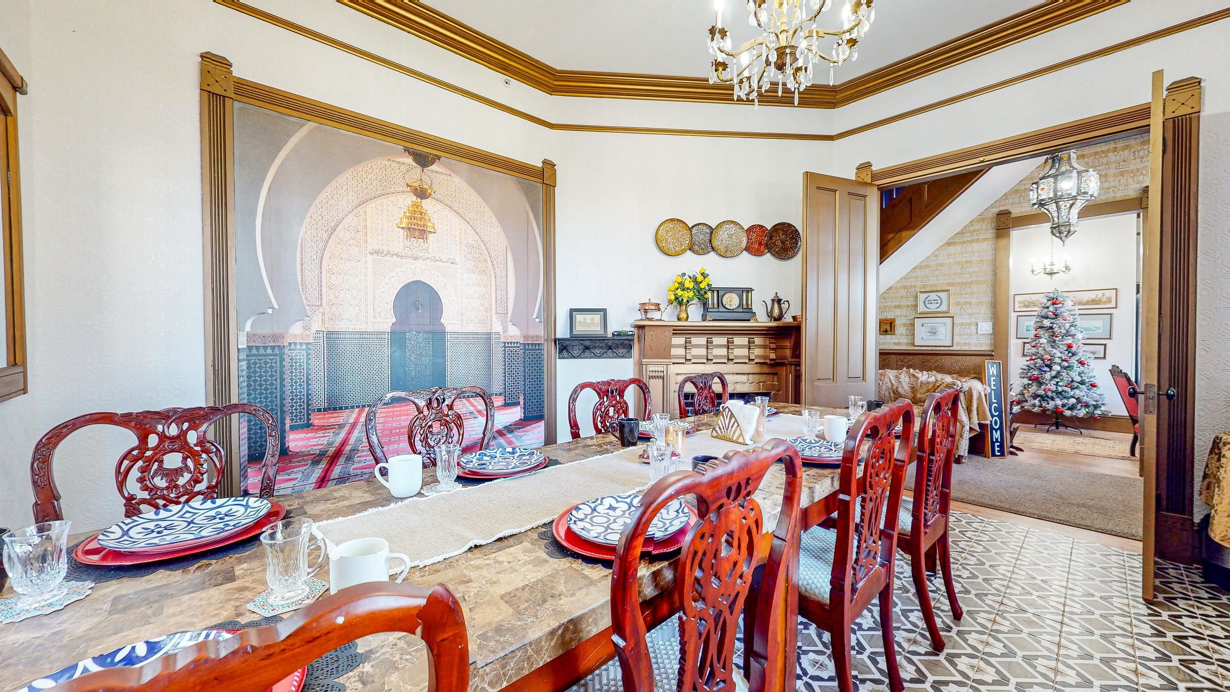 63 Orange Street St. Augustine, FL 32084 - Photo 11 of 74 a view of a dining room with furniture large windows and wooden floor