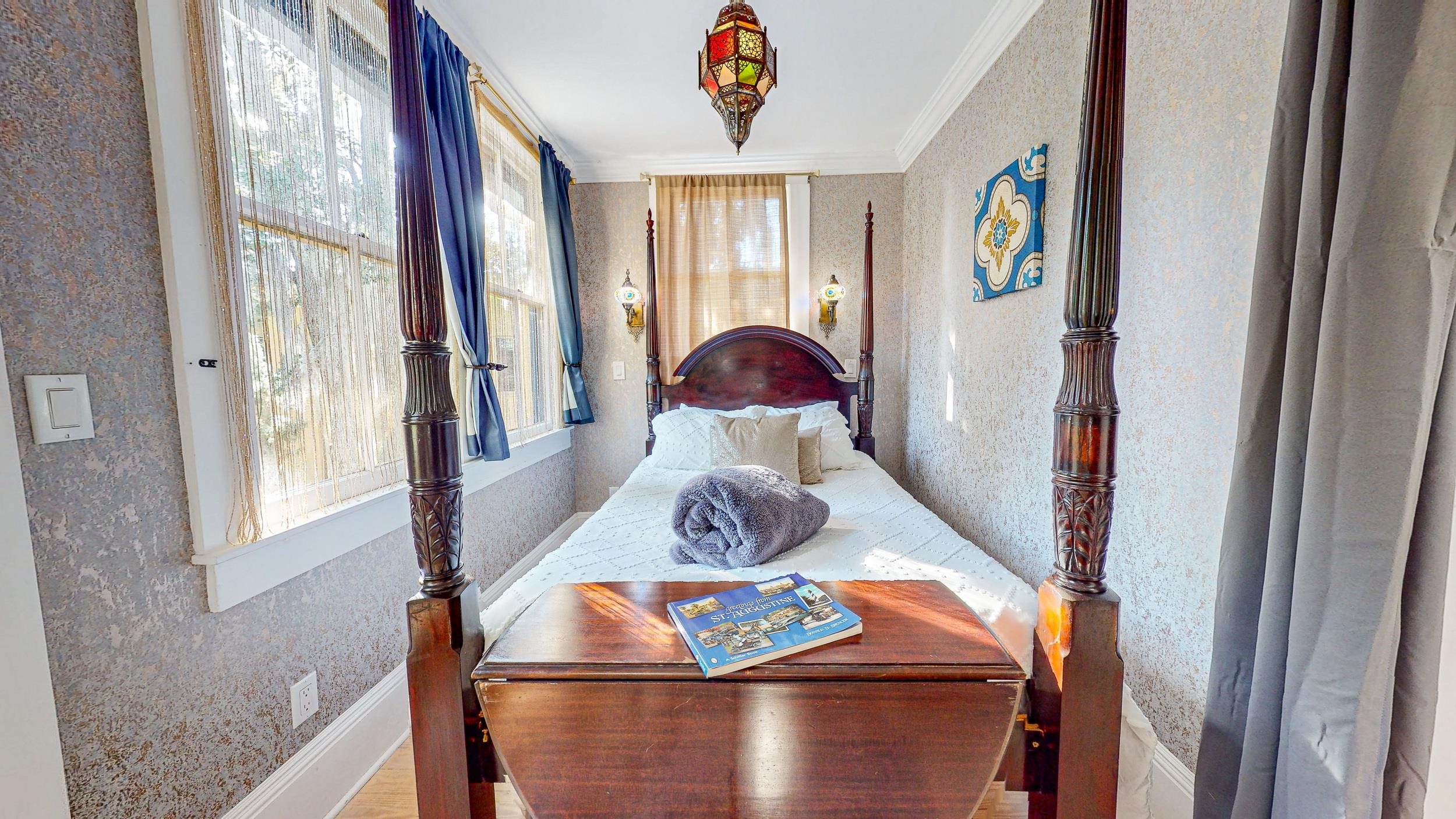 63 Orange Street St. Augustine, FL 32084 - Photo 46 of 74 a view of a dining table and chairs in a room