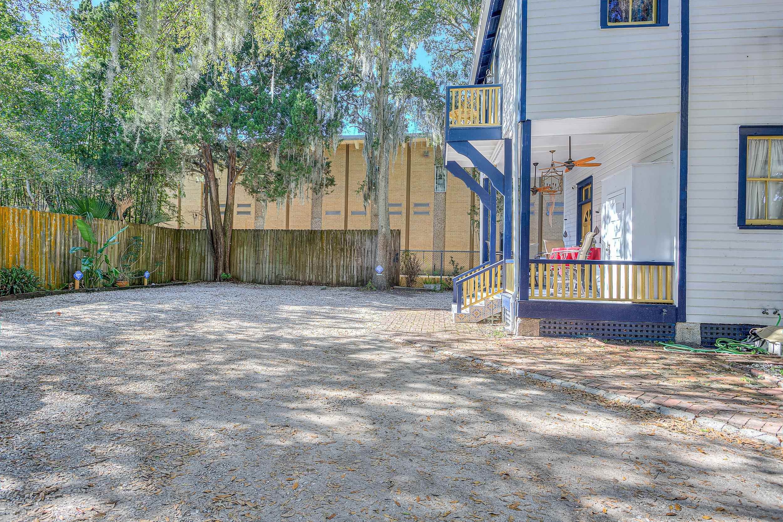 63 Orange Street St. Augustine, FL 32084 - Photo 66 of 74 a view of a house with a small yard and a large tree
