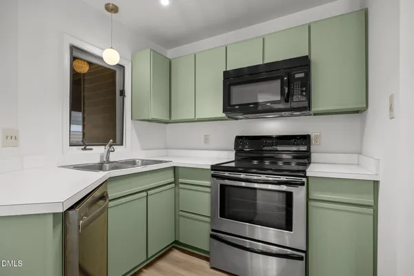 a kitchen with a stove and a microwave